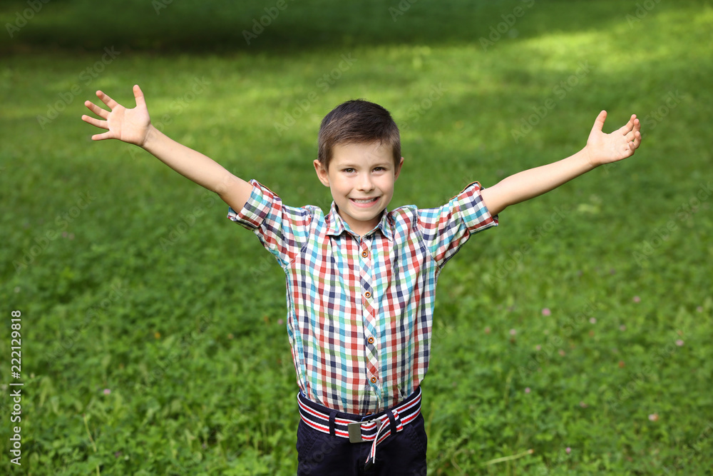 Cute little boy in park on summer day Cute little boy in park on summer day