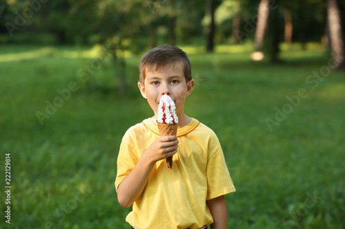 Cute little boy eating ice ...