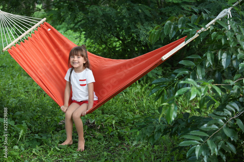 Cute little girl relaxing i...