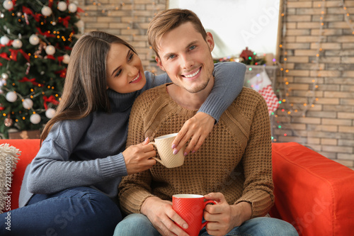 Cute young couple drinking ...