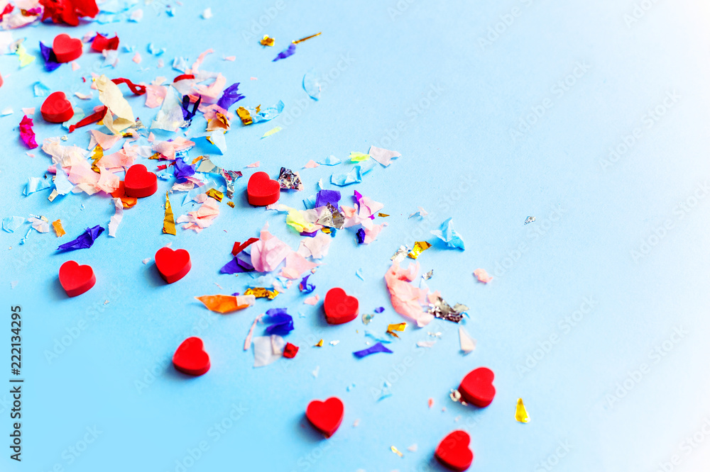 Blue paper with bright confetti. Copy space. Blue paper with bright confetti. Copy space.