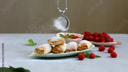 cookies with raspberry jam sprinkled with sugar powder along with fresh raspberry berries, place for text