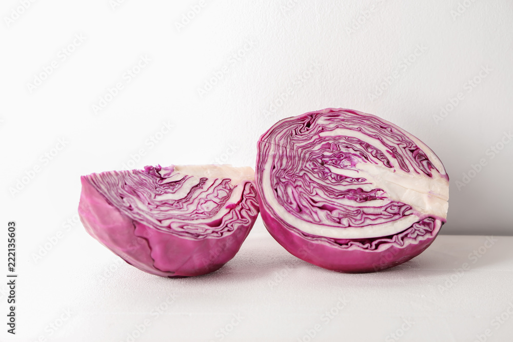 Fototapeta premium Cut red cabbage on white table