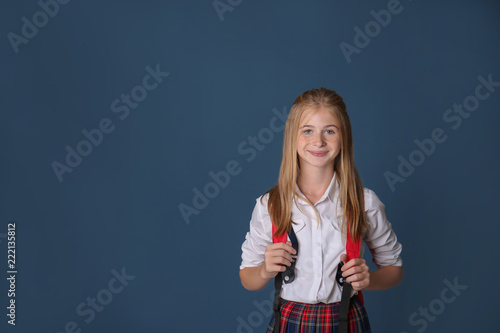 Cute schoolgirl with backpa...