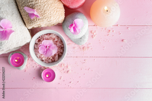 Spa composition with hydrangea flowers, candles and sea salt on color table