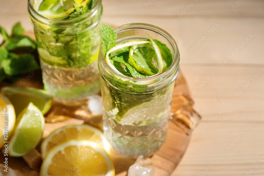 Jars of fresh mojito on wooden table Jars of fresh mojito on wooden table