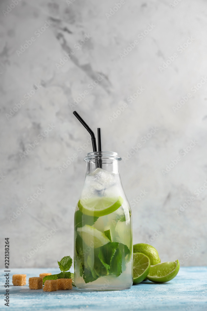 Bottle of fresh mojito on light table Bottle of fresh mojito on light table