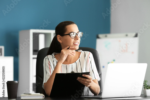 Young businesswoman working...