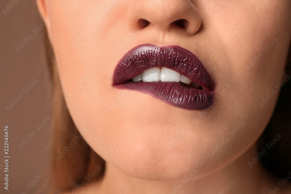 Fototapeta premium Beautiful young woman with dark lipstick, closeup