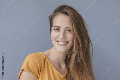 Portrait of a pretty woman, smiling, looking at camera