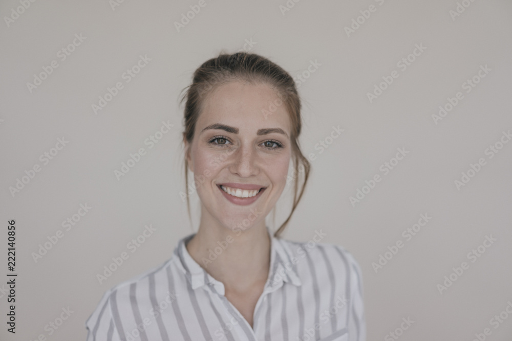 Portrait of a pretty woman, smiling, looking at camera Portrait of a pretty woman, smiling, looking at camera