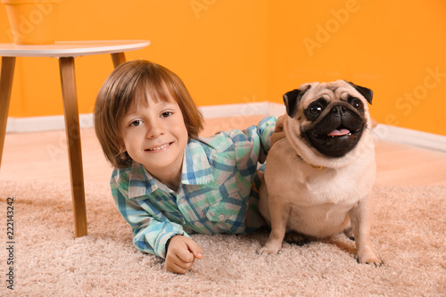 Little boy lying with cute ...