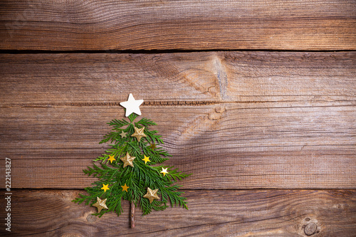 christmas tree on wooden board with many stars