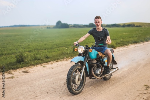 man is traveling on a classic retro motorcycle