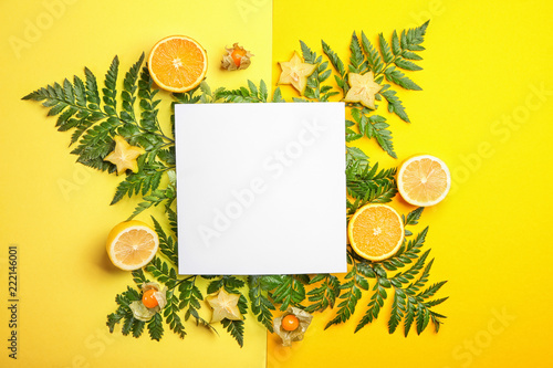 Summer composition with fresh tropical leaves, blank card and fruits on color background