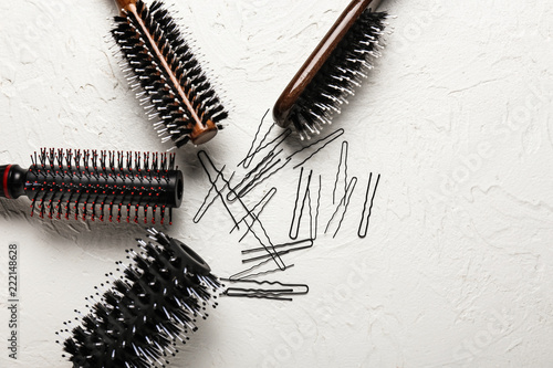 Hair brushes with pins on light background