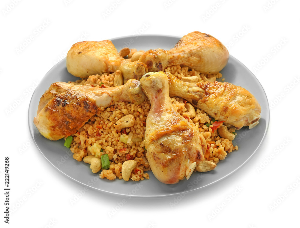 Plate with boiled rice, chicken legs and vegetables on white background Plate with boiled rice, chicken legs and vegetables on white background