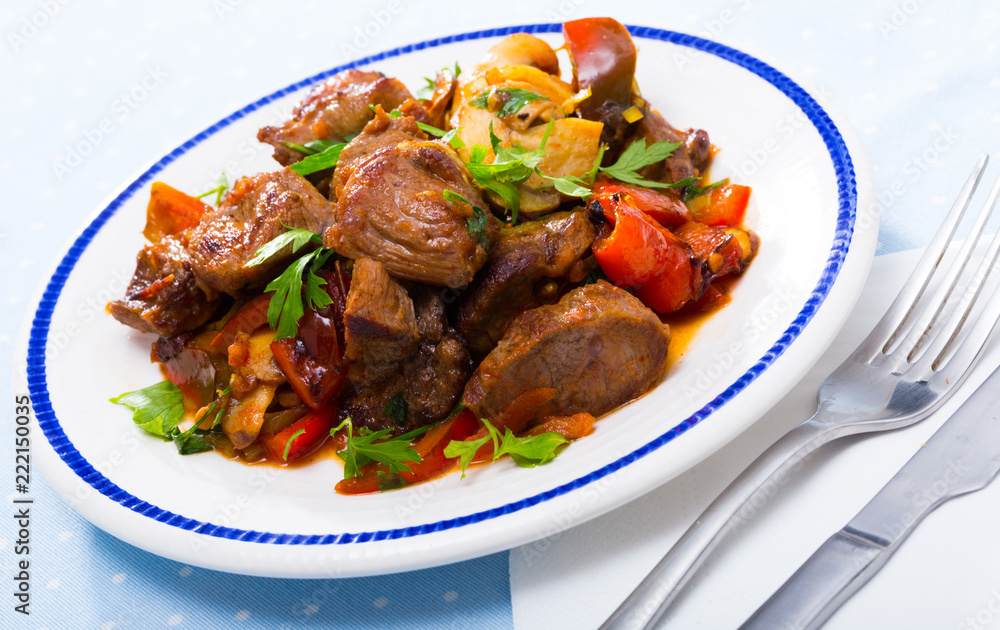 Stewed meat with vegetables and mushrooms
