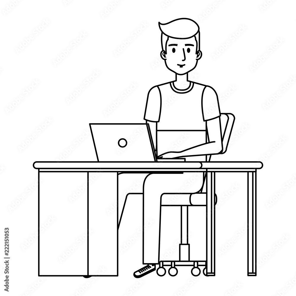 young man at desk with laptop
