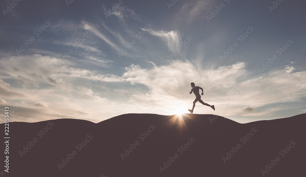 The man with runner on the street be running for exercise.