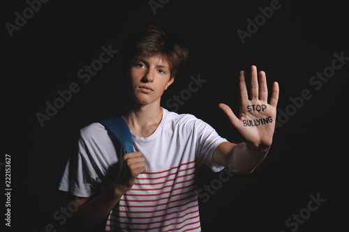 Teenage boy with text STOP ...