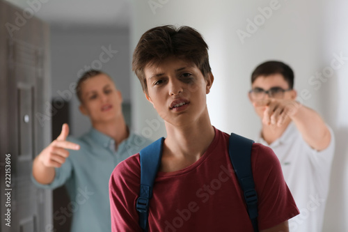 Sad teenage boy indoors. Bu...