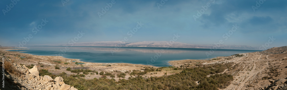 Panoramic landscape of Dead Sea and Jordan mountains in middle day