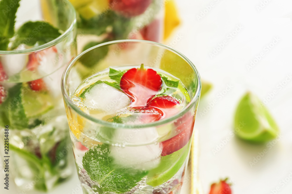 Glasses of fresh strawberry lemonade on light table, closeup Glasses of fresh strawberry lemonade on light table, closeup