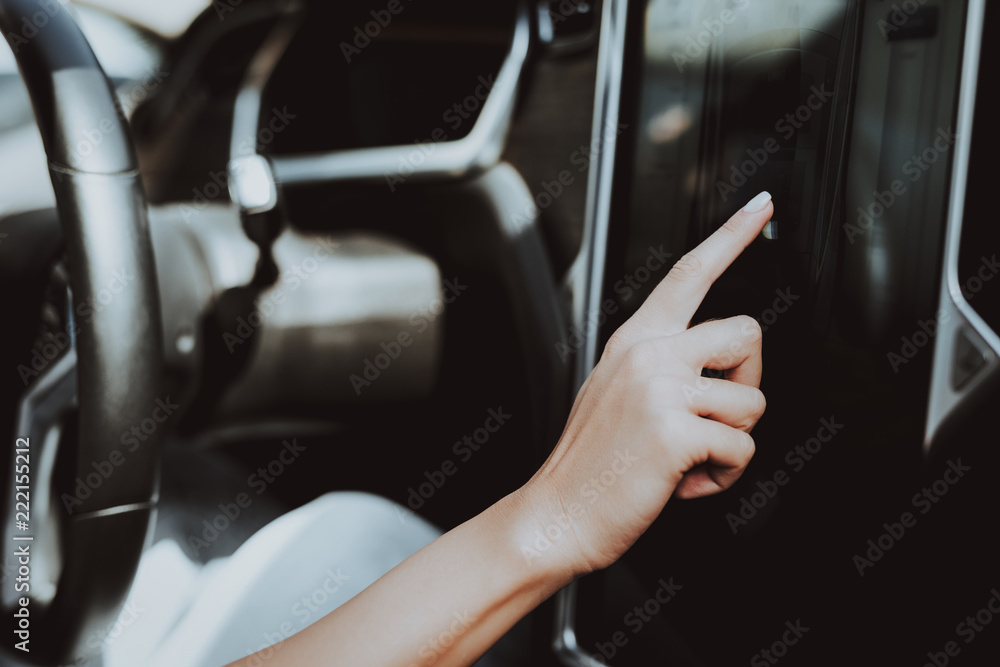 Woman In Tesla Car. Behind The Wheel Concept. Woman In Tesla Car. Behind The Wheel Concept.