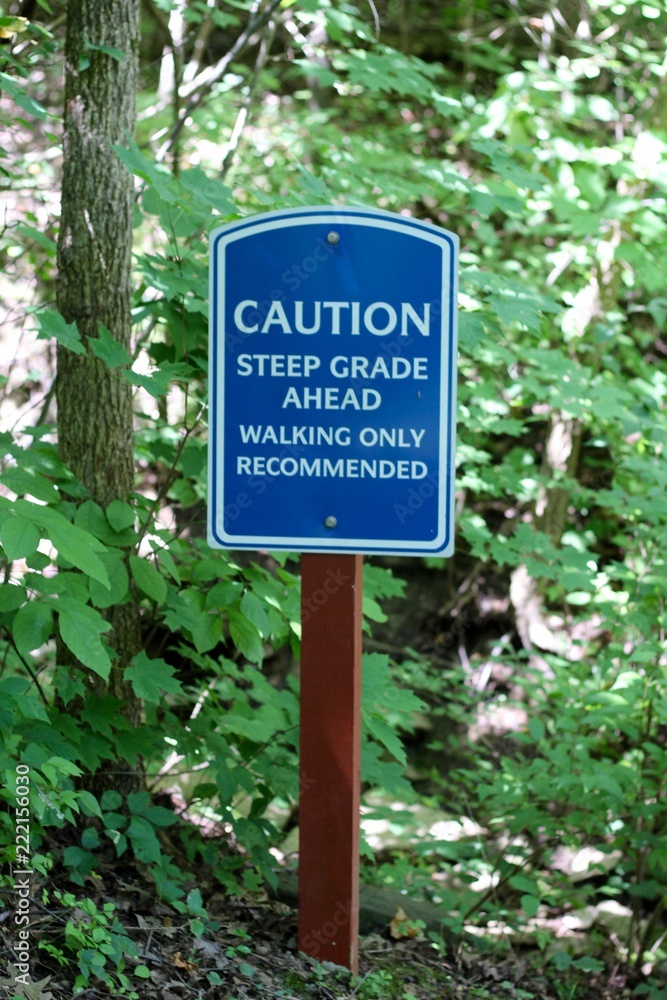 The blue and white caution and warning sign. 