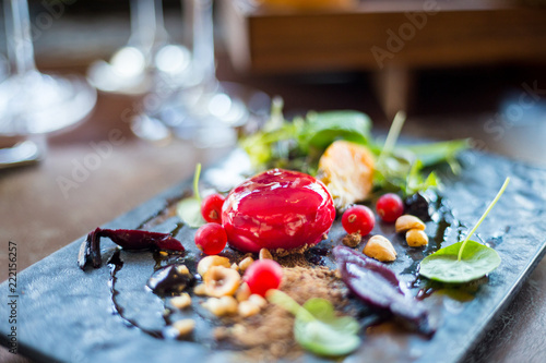 Salad with Goat Cheese glazed in Strawberry Jam  Beetroot  Rucola Leaves and Pine Nuts in Luxury Restaurant for the Dinner