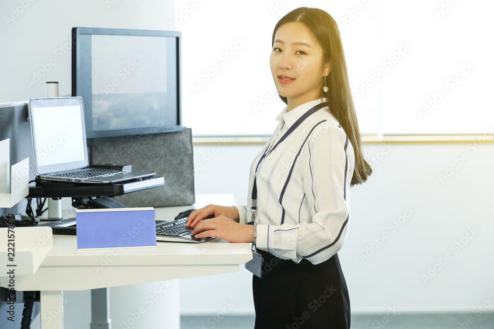 Asian female white collar worker using computer Asian female white collar worker using computer
