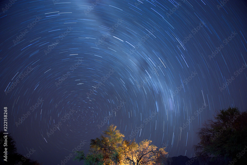 Naklejka premium Star trails in Namibia desert lanscape