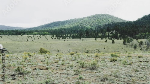 4K shot of people riding trails in the mountains of Colorado photo