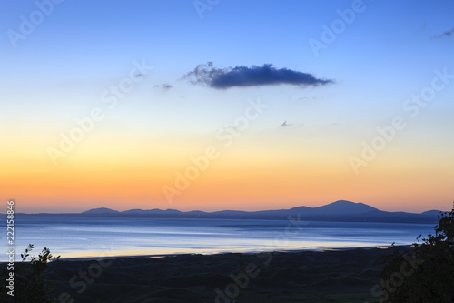 Looking over the Llyn Peninsula and Isle of Anglesey Gwynedd Wales at sunset photo