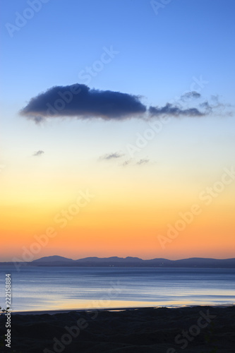 Looking over the Llyn Peninsula and Isle of Anglesey Gwynedd Wales at sunset
