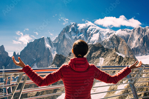 woman, tourist on the terrace Punta Helbronner in Courmayeur Italy , over mountain Montblanc
