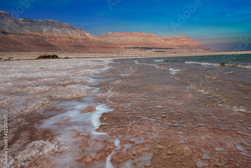 Amazing panoramic Dead Sea with blue and teal colors shot on the beach line