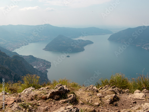 View of Italian Alpine Lake Iseo and the near Mountains, the lake Shore and island of Monte Isola with the small village photo