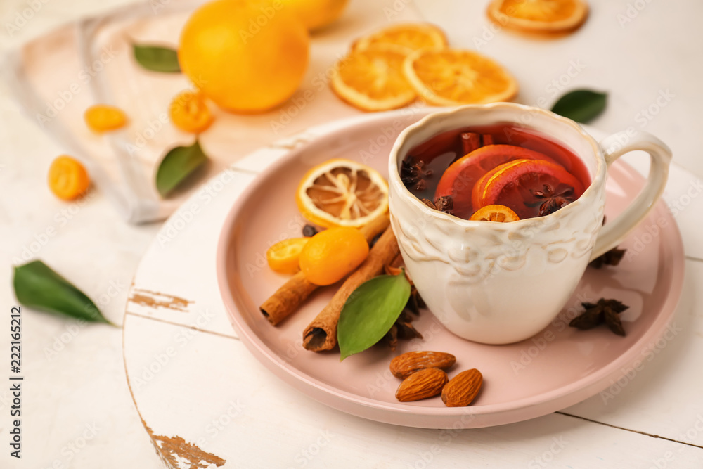 Cup of delicious mulled wine on light table Cup of delicious mulled wine on light table
