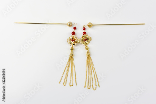 Gold hair clips in white background