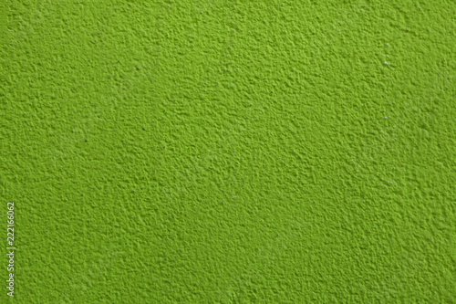 Green painted stucco wall.