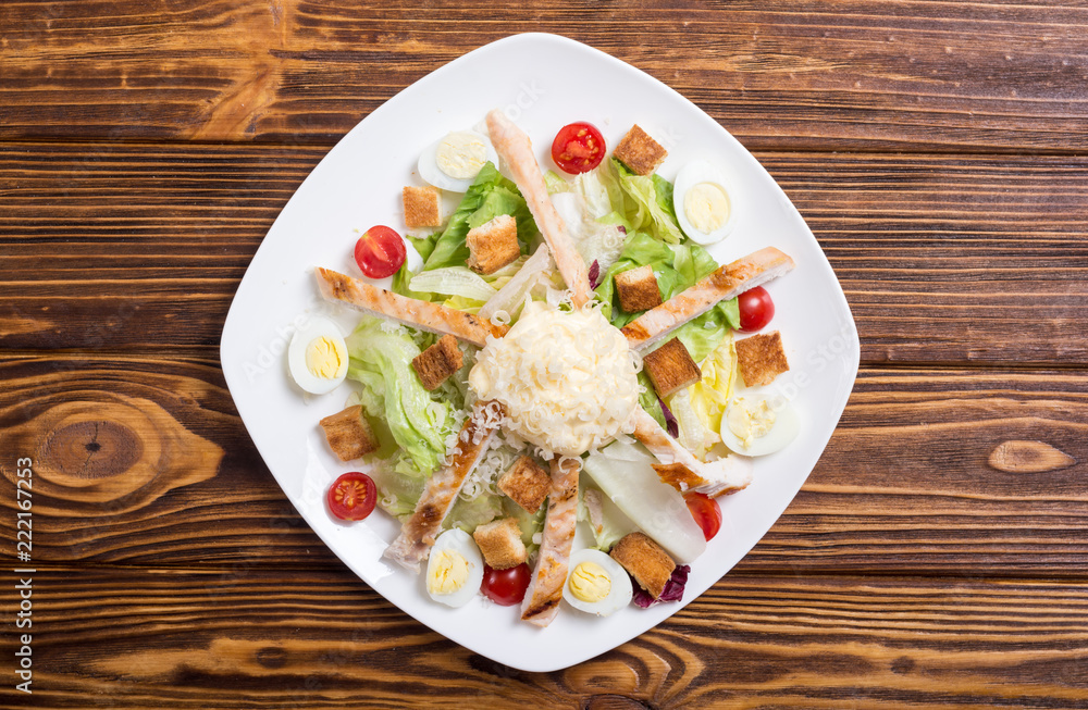 Salad ceasar with chicken , eggs and tomatoes Salad ceasar with chicken , eggs and tomatoes
