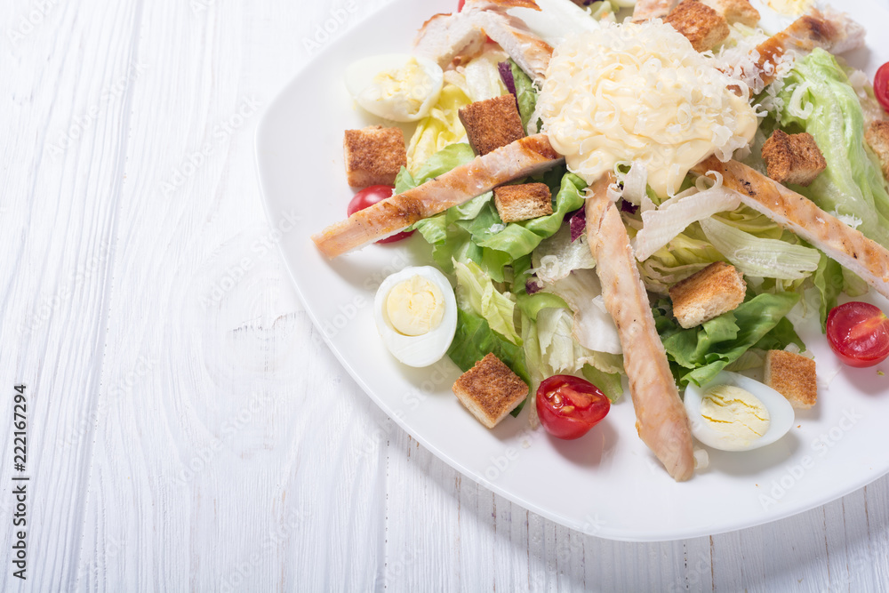 Salad ceasar with chicken , eggs and tomatoes Salad ceasar with chicken , eggs and tomatoes