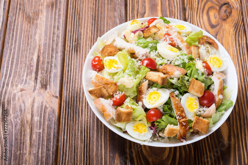 Salad ceasar with chicken , eggs and tomatoes