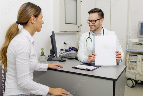 Handsome doctor is talking ...