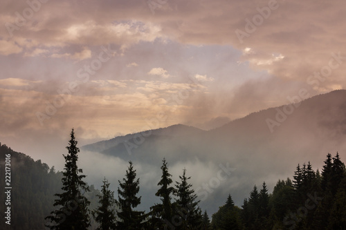 Fototapeta Naklejka Na Ścianę i Meble -  Summer mountain scenery with mist clouds, at sunset