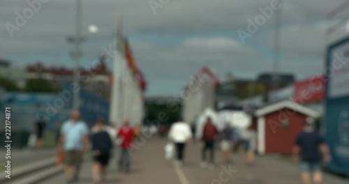 Blurred people walking through Gothia Cup area in central Gothenburg photo