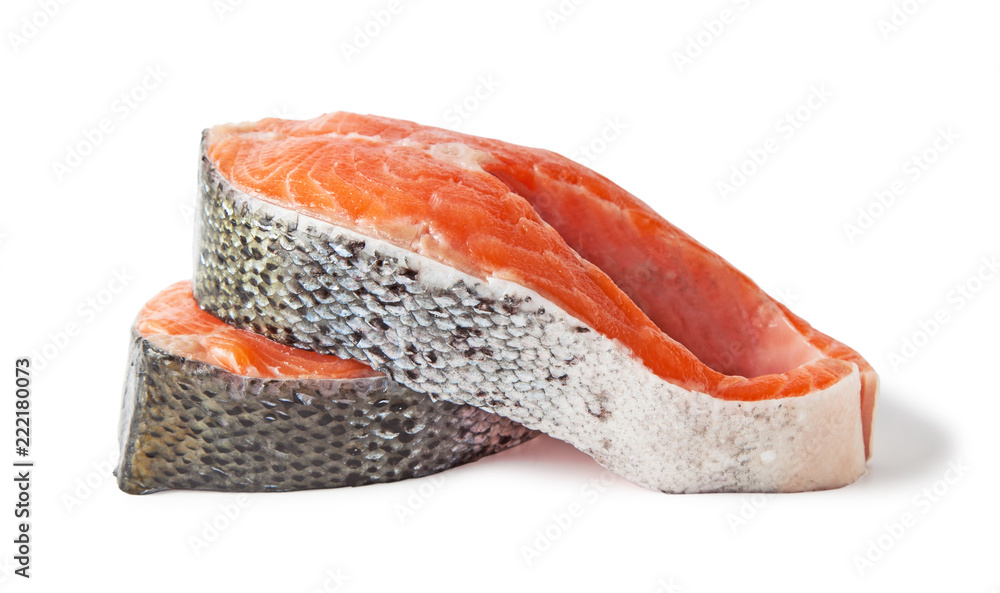 Raw salmon steaks slices, isolated on a white background. Raw salmon steaks slices, isolated on a white background.