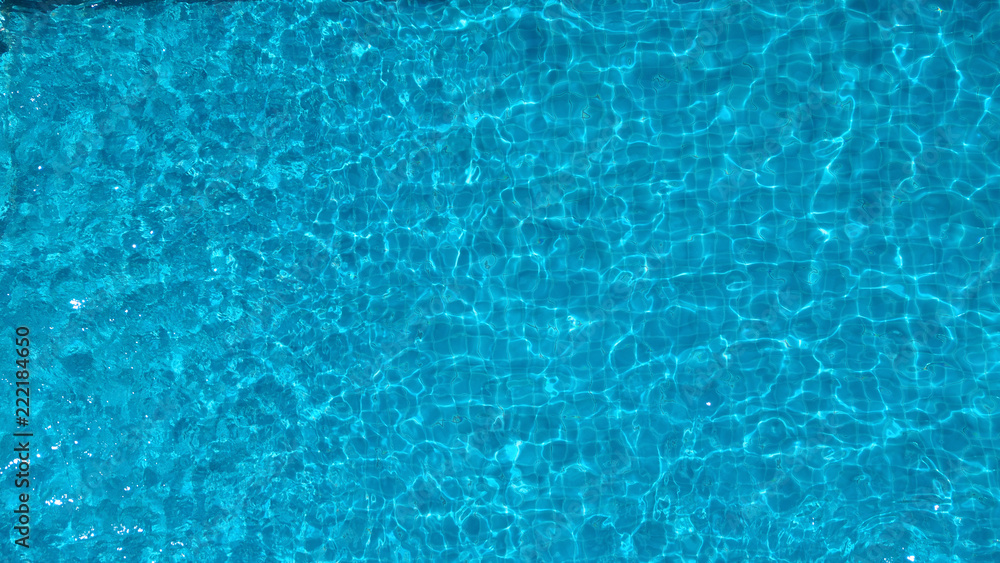 Bird eyes view images of hotel swimming pool salt system not clorine which have blue clear color water and good for health and relaxing in summer vacation day on Bangkok Thailand
